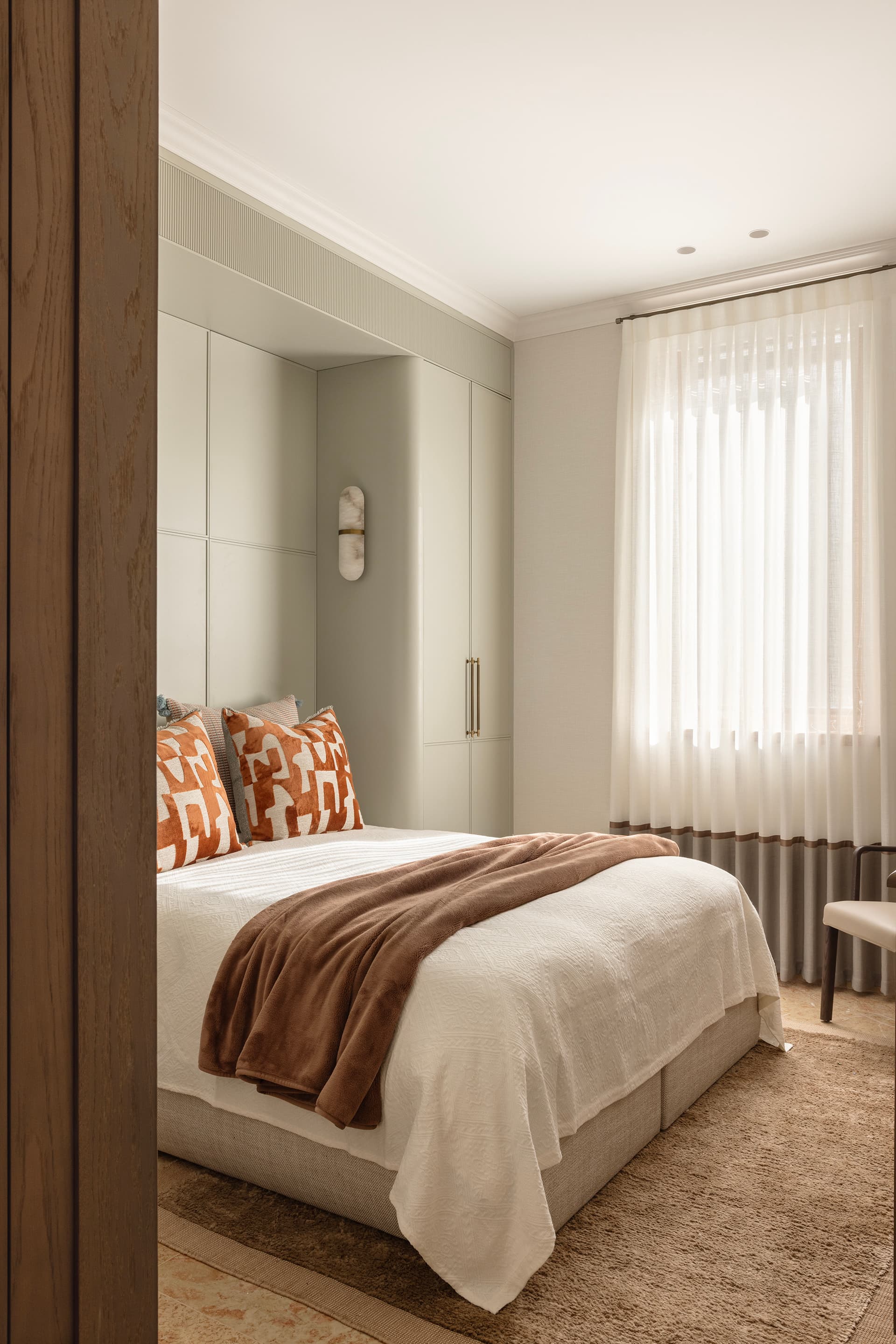 Children's bedroom with custom storage and textiles