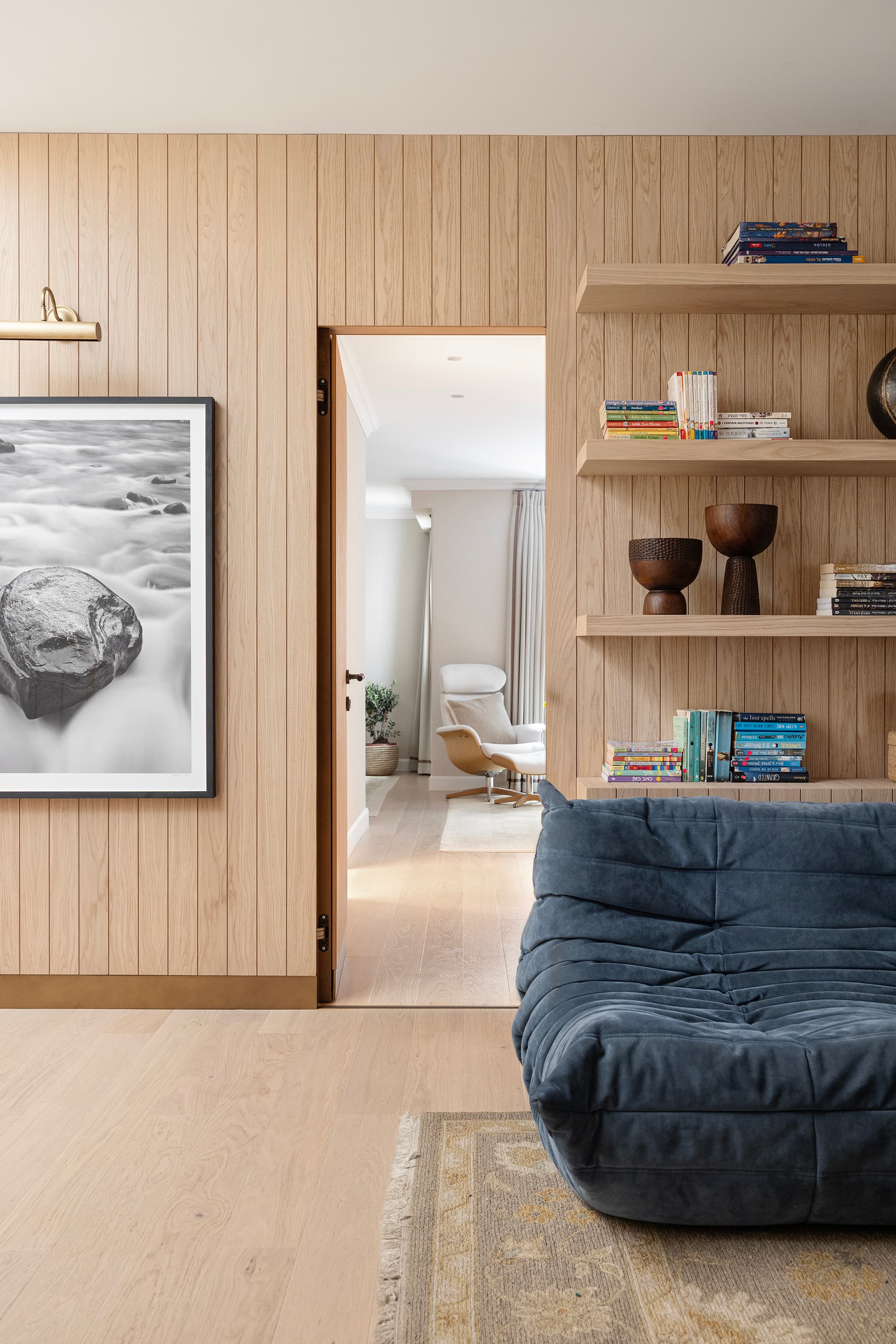 Family room seating with custom cabinetry and rug