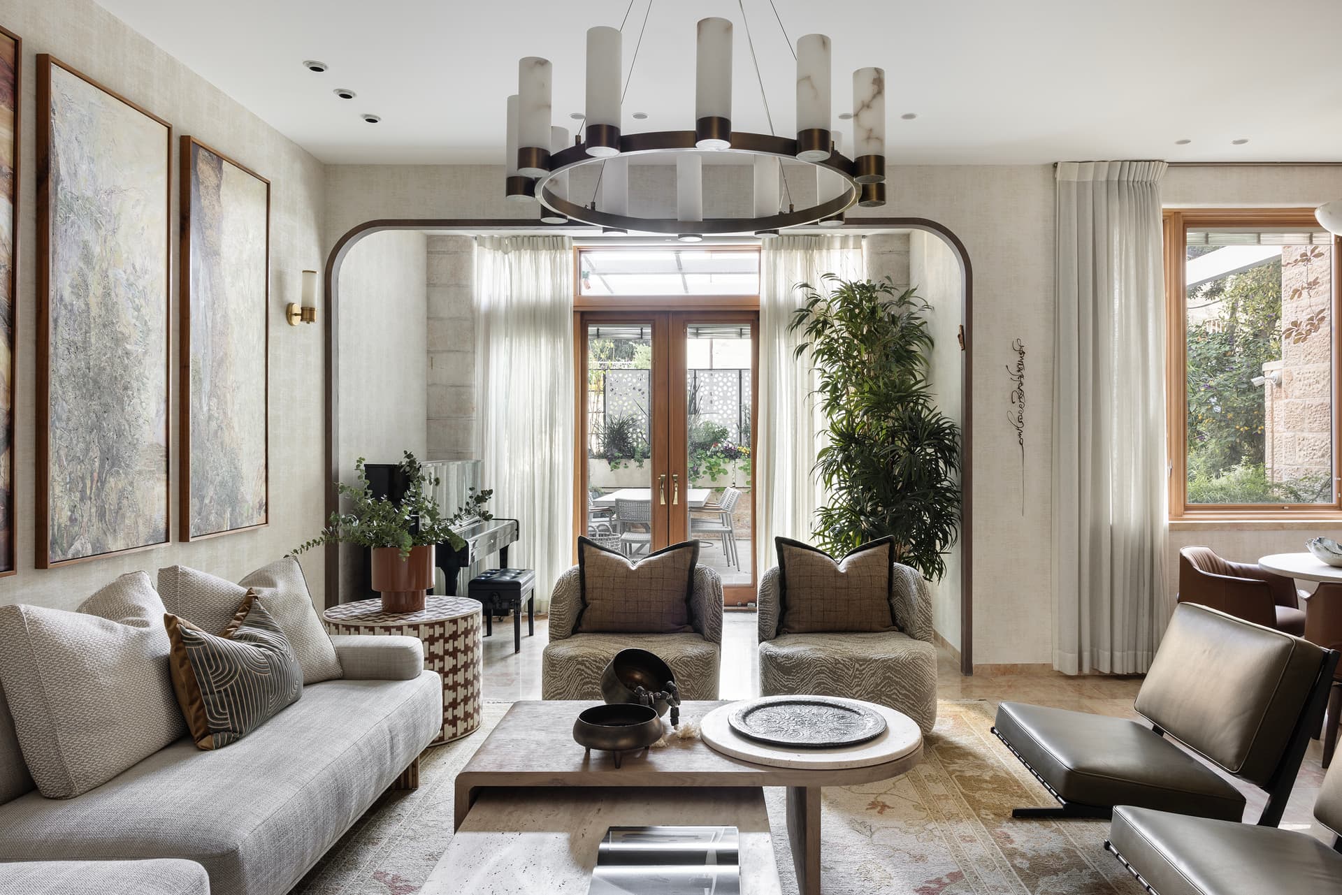 Living room seating area with bookshelves and artwork